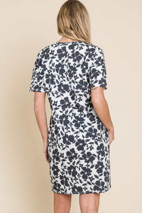 BOMBOM Floral Mini Dress with vibrant floral print, short sleeves, and back view.