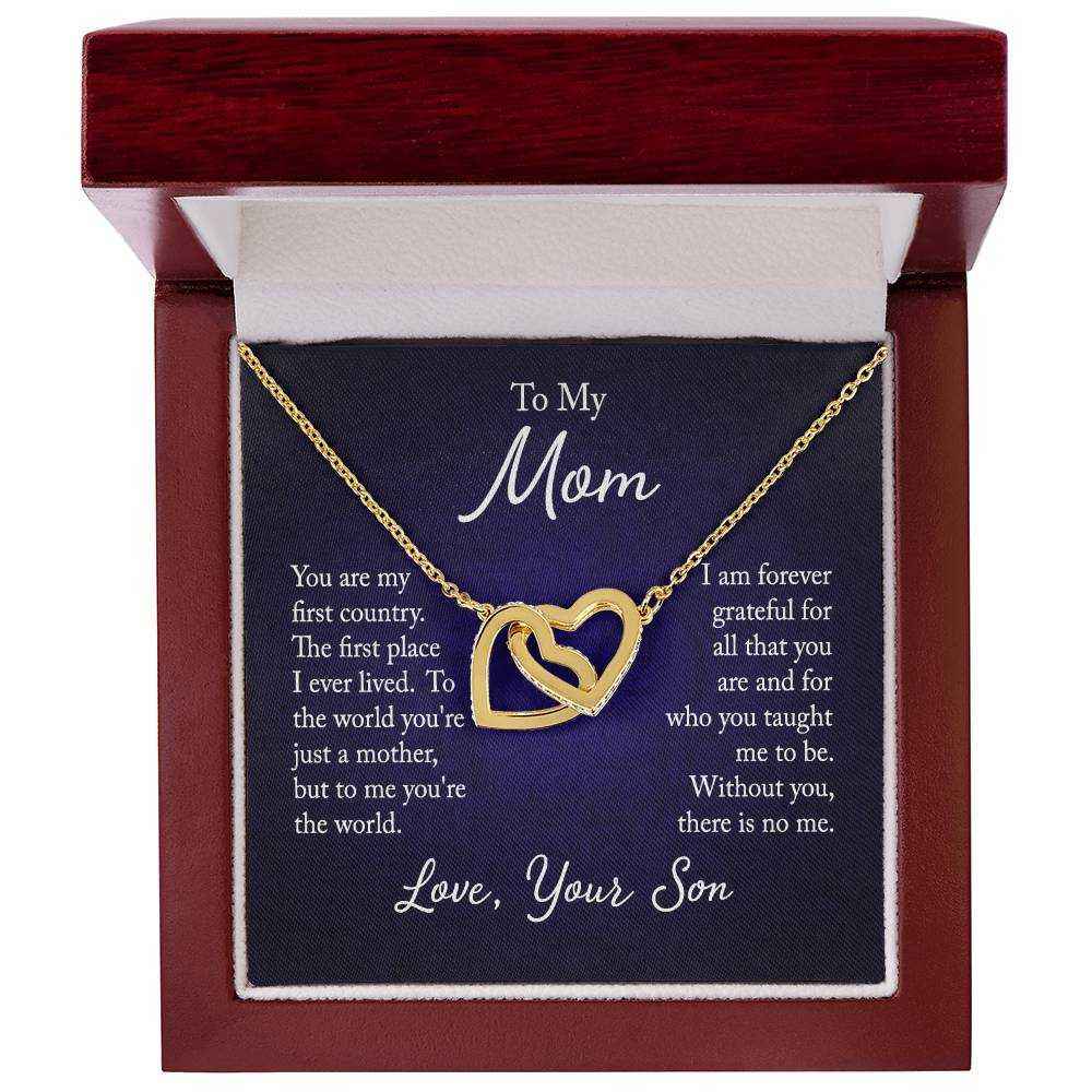 Close-up of Interlocking Hearts Necklace for Mom from Son with rose gold finish and CZ crystals on a white background