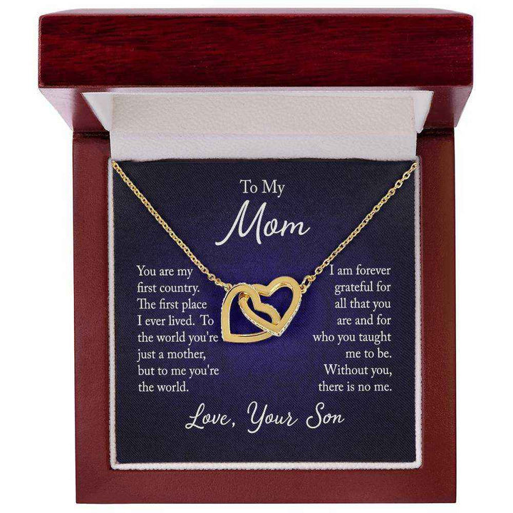 Close-up of Interlocking Hearts Necklace for Mom from Son with rose gold finish and CZ crystals on a white background