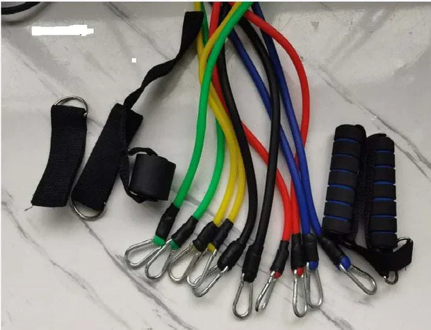 Fitness resistance bands set with colorful bands, handles, and attachments for versatile workouts.