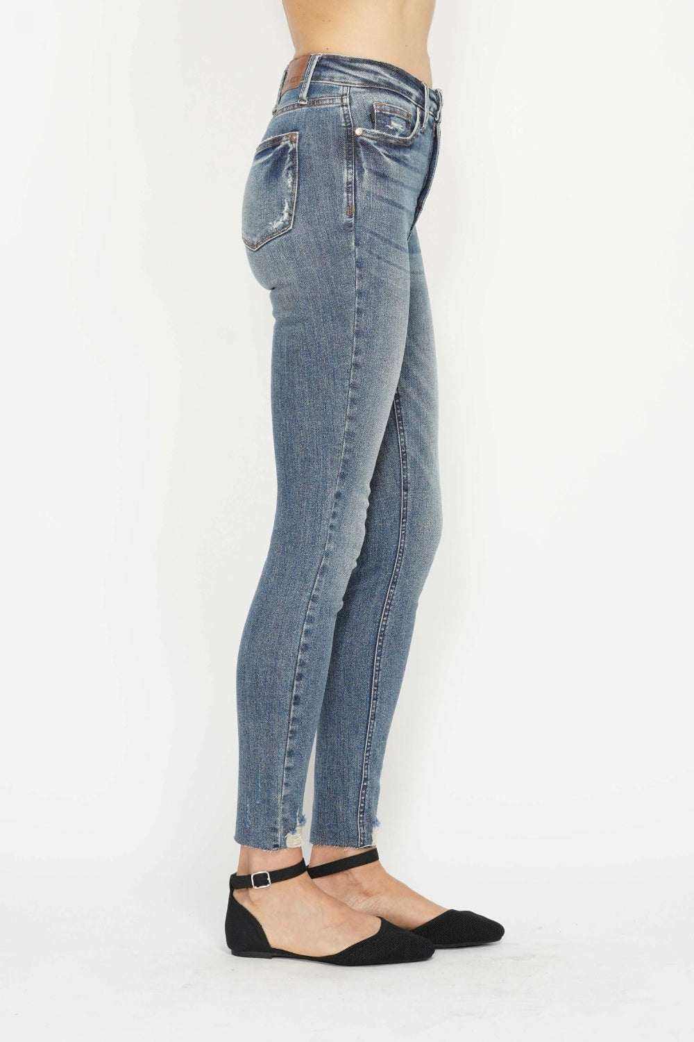 Judy Blue Tummy Control Skinny Jeans with vintage wash and distressed hem from Hot Topic Goods