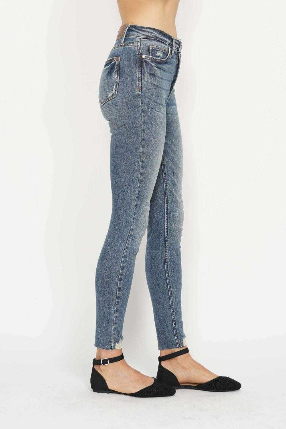 Judy Blue Tummy Control Skinny Jeans in vintage wash with distressed hem and tummy control waistband