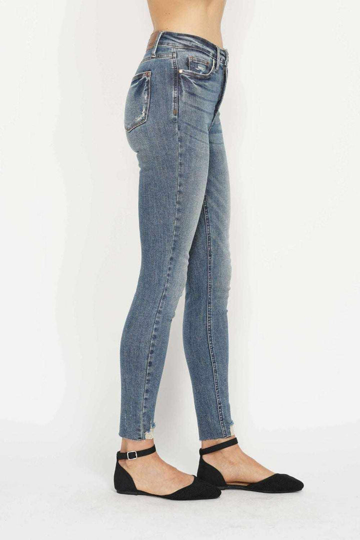 Judy Blue Tummy Control Skinny Jeans in vintage wash with distressed hem and tummy control waistband
