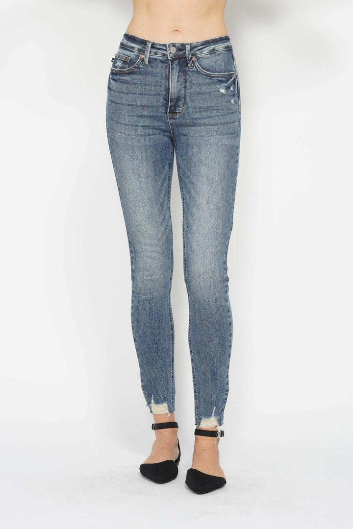 Judy Blue Tummy Control Skinny Jeans in vintage wash with distressed hem and tummy-control waistband