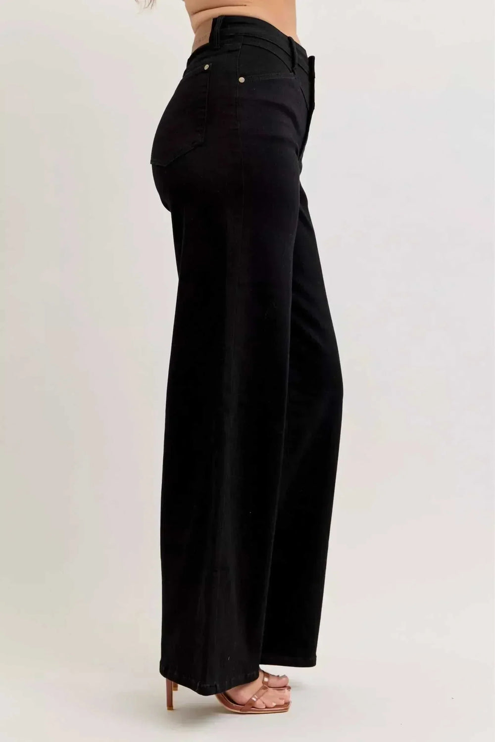 Women wearing Judy Blue Wide Leg Jeans from Hot Topic Goods showcasing high-rise, wide-leg denim style