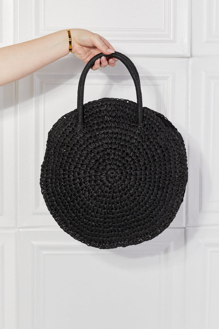 Justin Taylor Black Beach Date Straw Rattan Handbag with woven natural texture and black finish