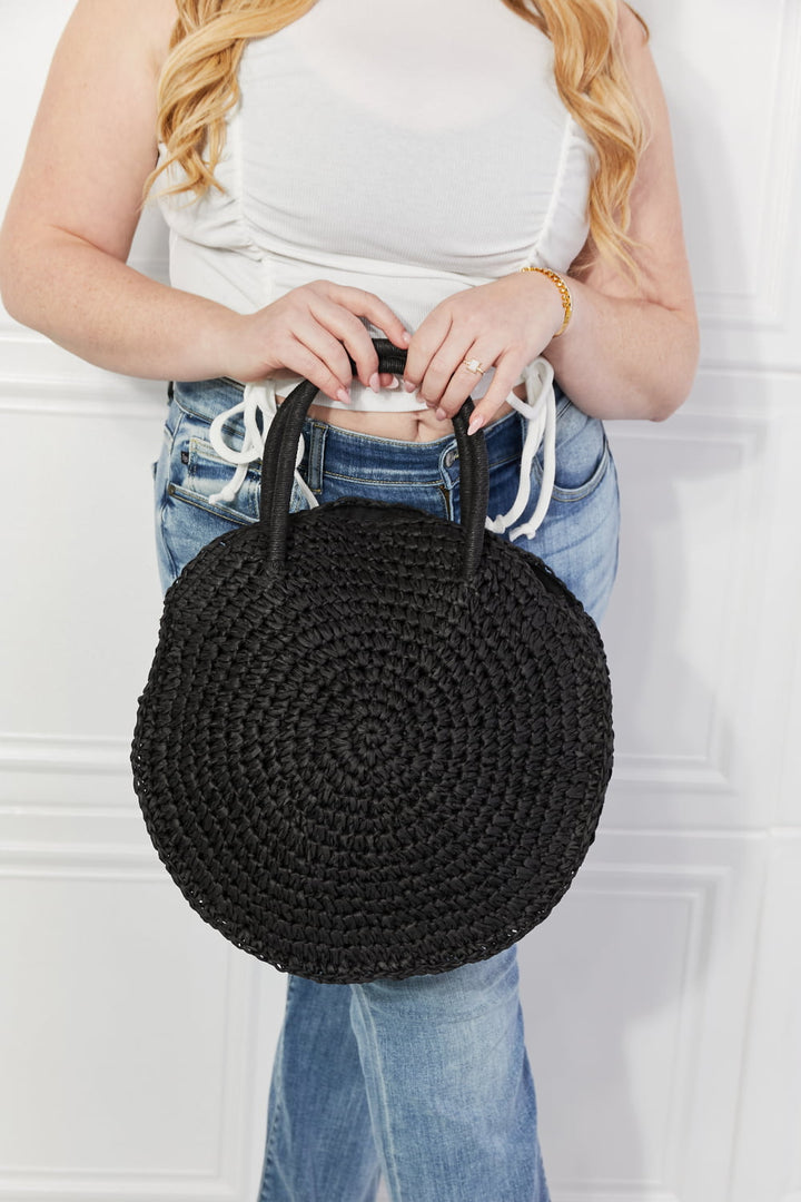 Justin Taylor Black Beach Date straw rattan handbag with woven texture and black finish
