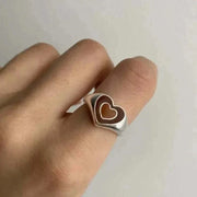 Creative Love Heart Ring featuring a unique heart-shaped design on a finger, made from high-quality alloy.
