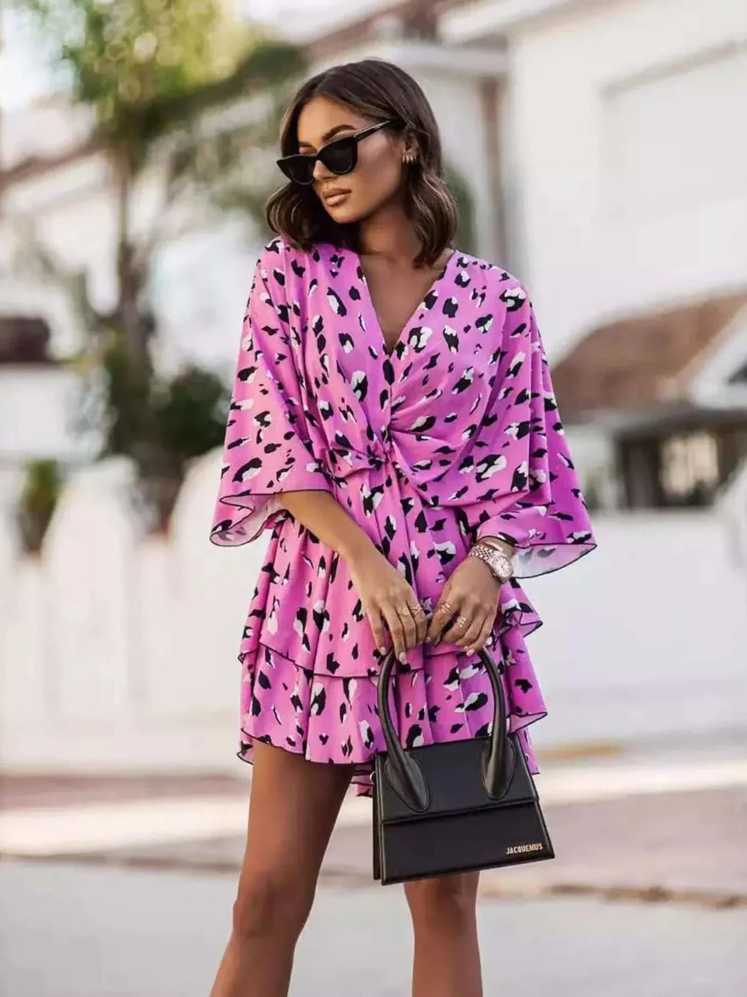 Women’s layered printed surplice mini dress with layered silhouette and vibrant print from Hot Topic Goods