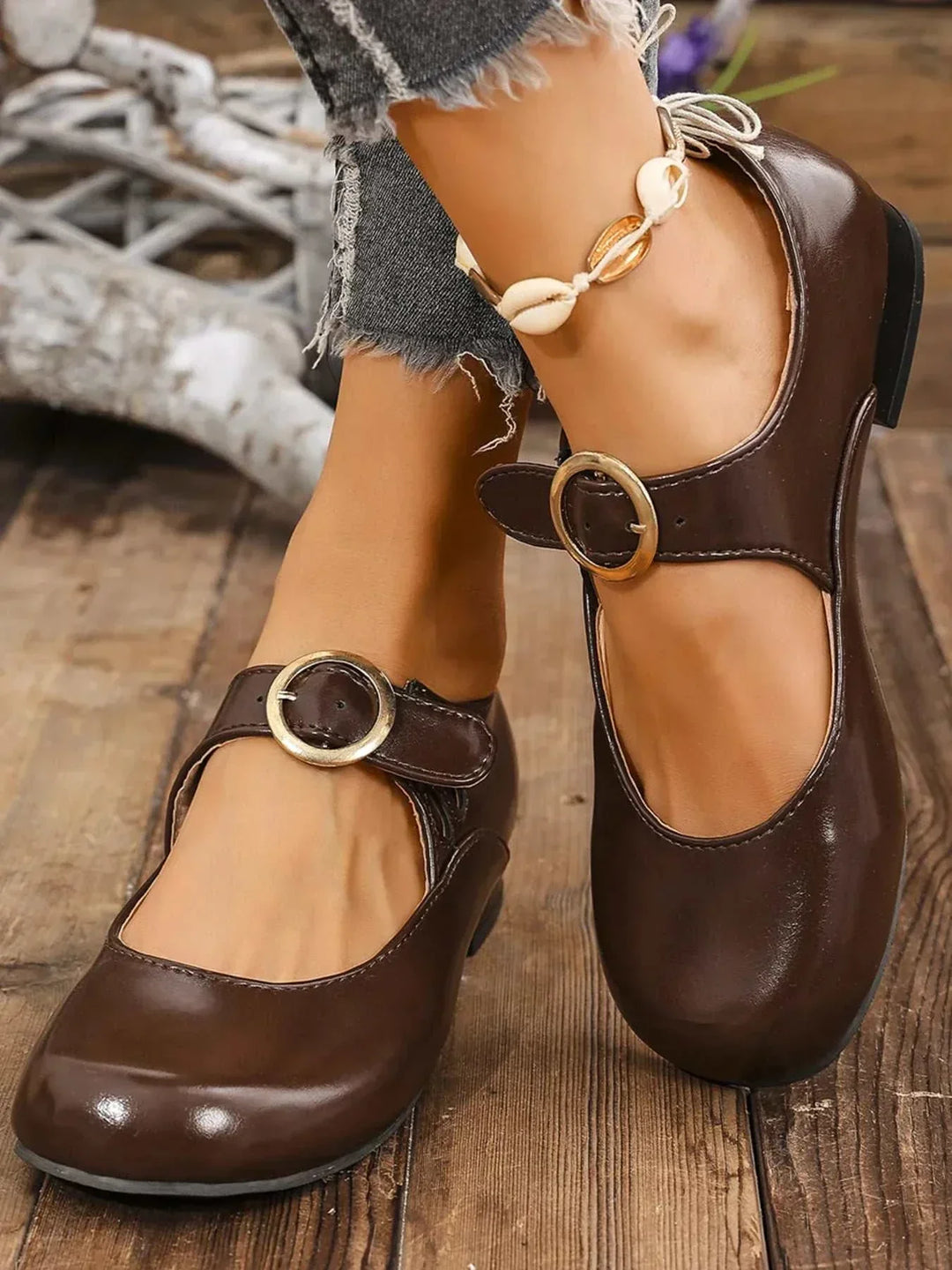 Pair of black Mary Jane buckle loafers for women with cushioned footbed and adjustable strap