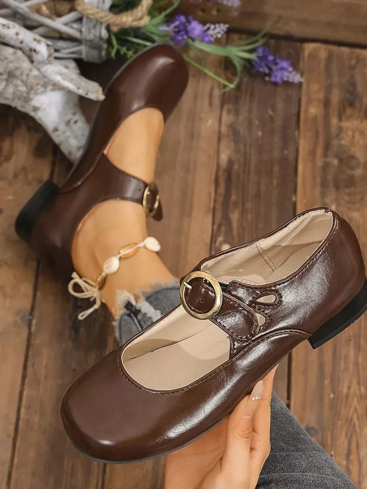 Pair of classic Mary Jane Buckle Loafers with adjustable buckle strap and cushioned footbed for women’s everyday comfort and style