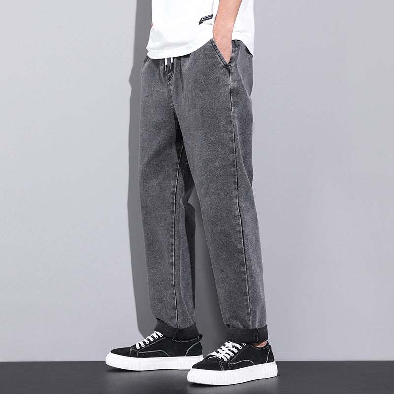 Men wearing drawstring wide leg straight jeans from Hot Topic Goods in casual outdoor setting