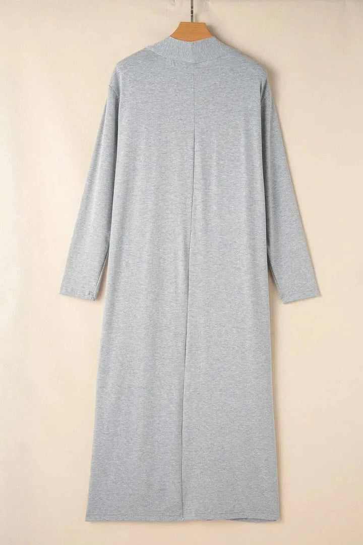 Woman wearing open front long sleeve cardigan lounge set with matching top and pants from Hot Topic Goods