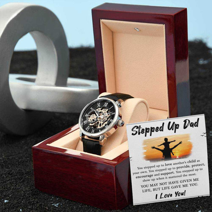 Openwork Watch for Stepped Up Dad with black leather band and intricate openwork dial from Hot Topic Goods in luxury mahogany-style box