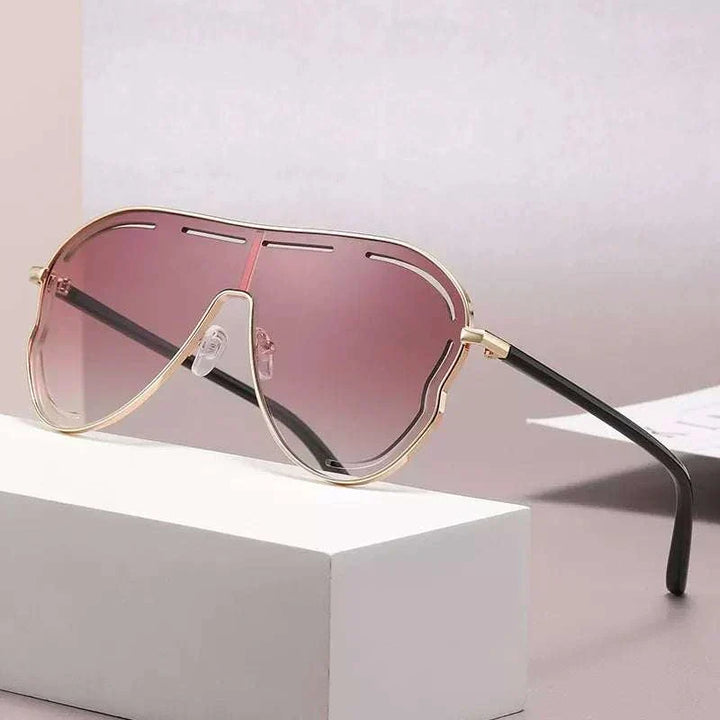 Oversized aviator sunglasses with gradient lenses and metal frame from Hot Topic Goods