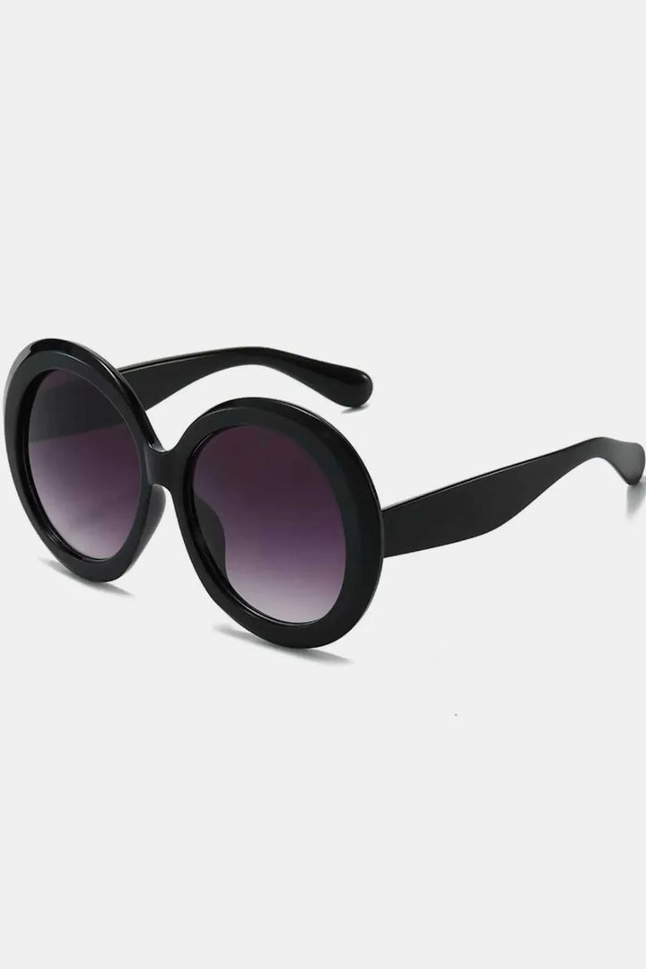 Oversized round sunglasses with light brown tinted lenses and dark frame from Hot Topic Goods