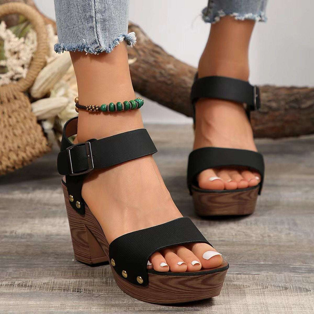 Women's peep toe block heel sandals in black leather with adjustable ankle strap from Hot Topic Goods