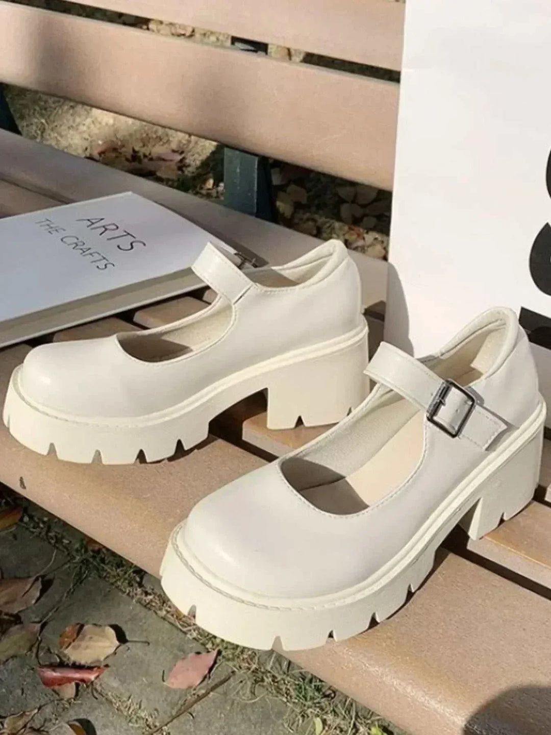 White platform Mary Jane loafers with chunky soles and adjustable buckle strap from Hot Topic Goods