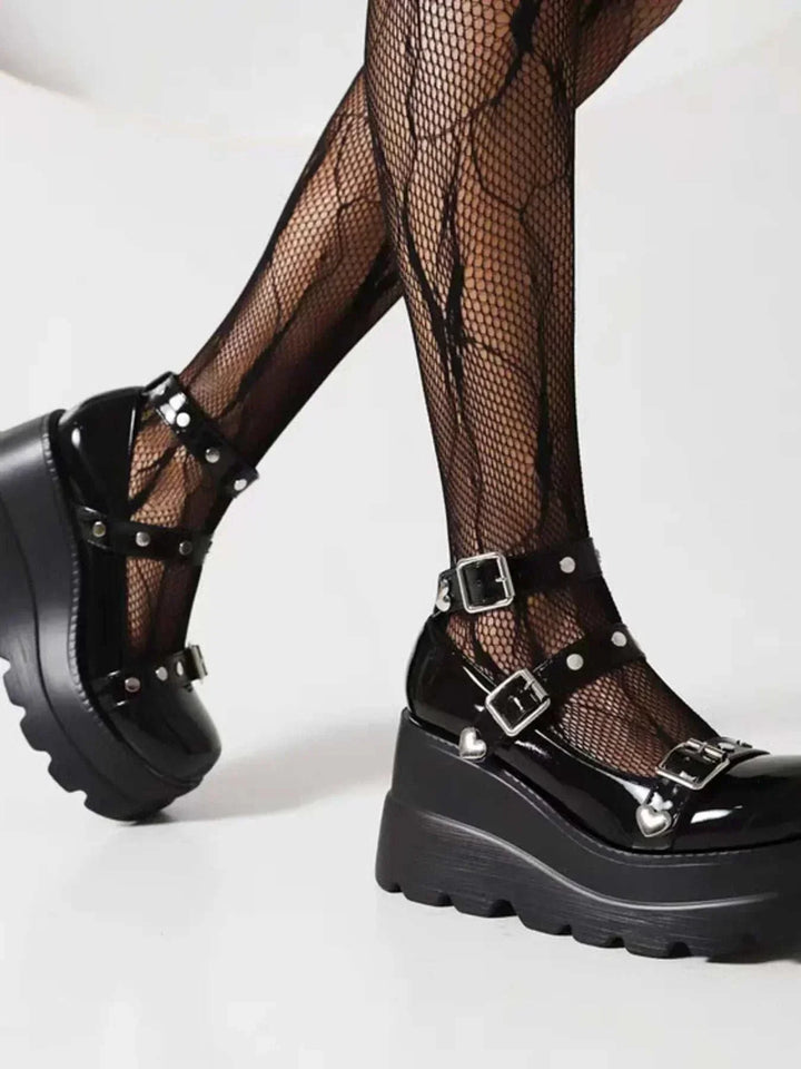 Platform Mary Jane triple buckle shoes with elevated platform soles and adjustable straps in neutral tones