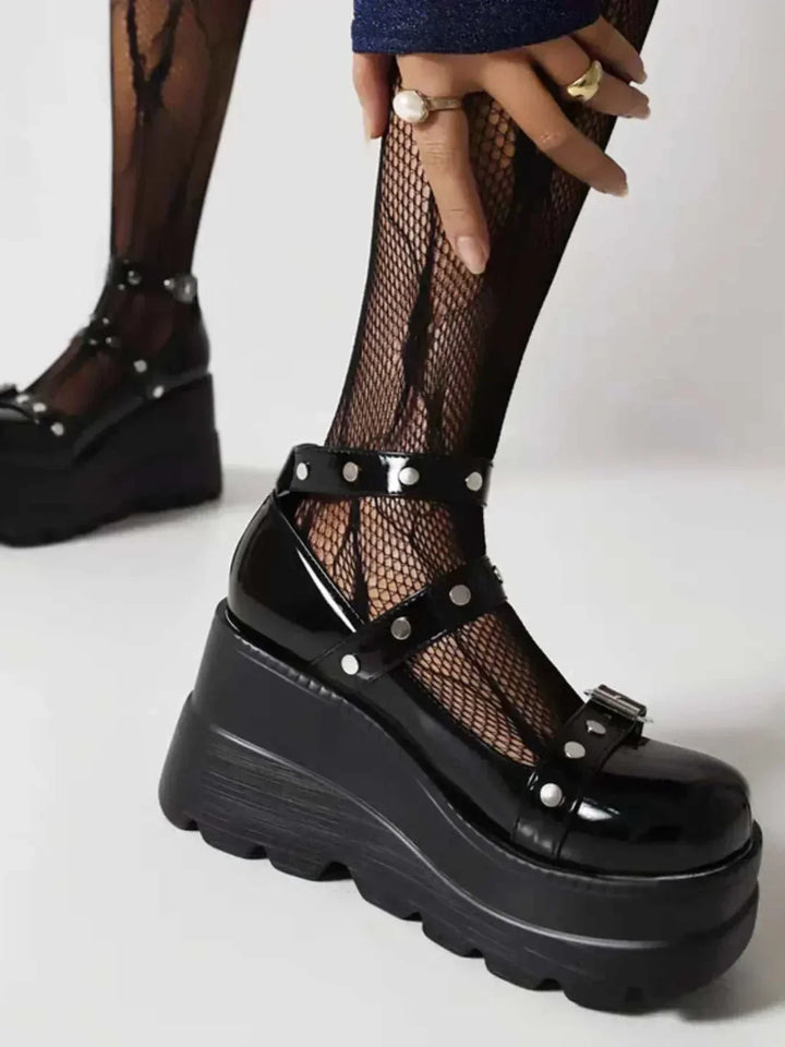 Platform Mary Jane triple buckle shoes with elevated soles and adjustable straps in neutral color