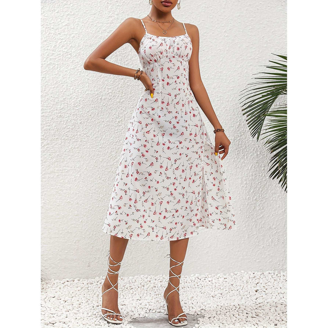 Woman wearing sleeveless Polka Dot Split Maxi Sunddress with side slit and flowing silhouette