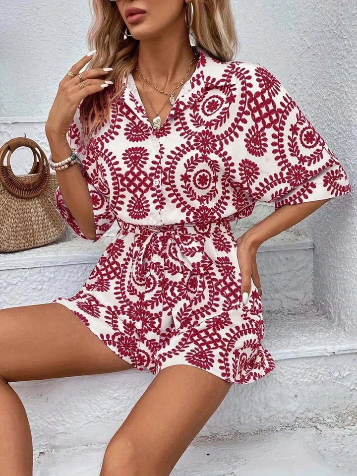 Woman wearing a stylish printed tie waist button-front romper from Hot Topic Goods
