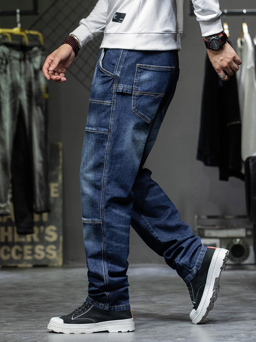 Men's relaxed cargo jeans in durable denim with functional pockets and comfortable fit from Hot Topic Goods