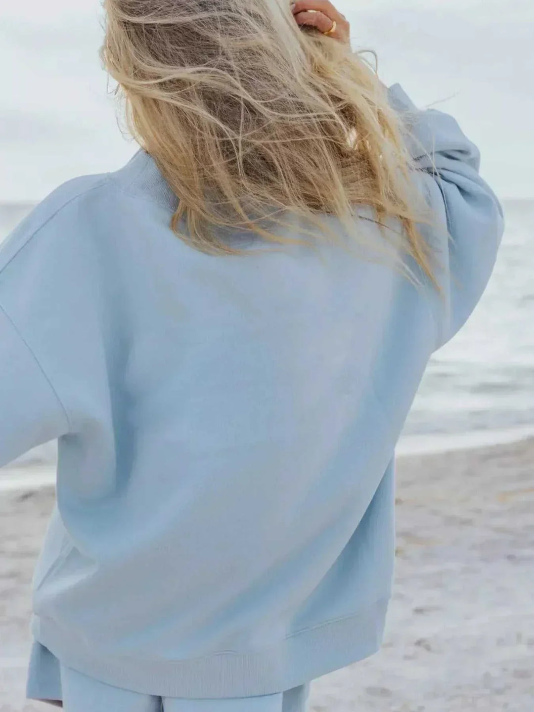 Women wearing coordinated relaxed sweatshirt and shorts set from Hot Topic Goods