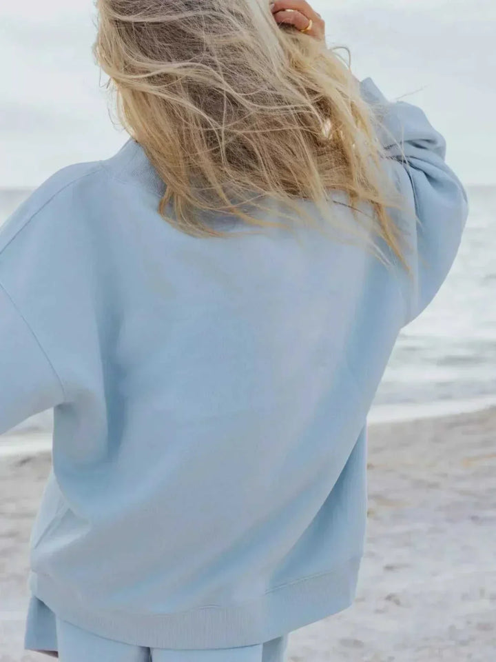 Women wearing coordinated relaxed sweatshirt and shorts set from Hot Topic Goods