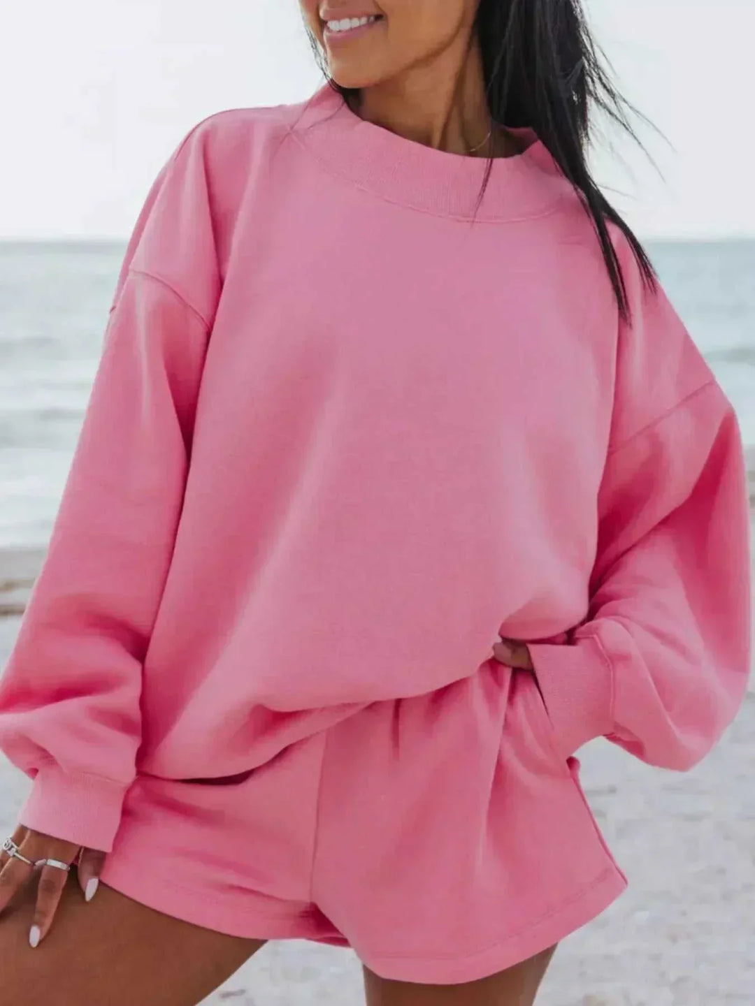 women wearing relaxed sweatshirt and shorts set from Hot Topic Goods in casual setting