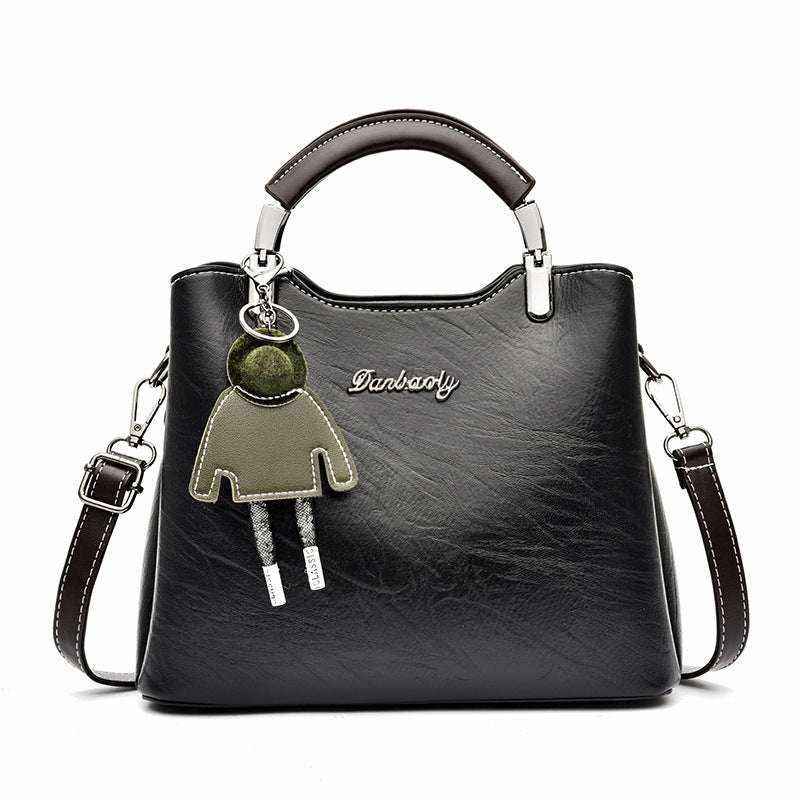 Women's retro small top handle handbag in vintage style with structured silhouette and compact design from Hot Topic Goods