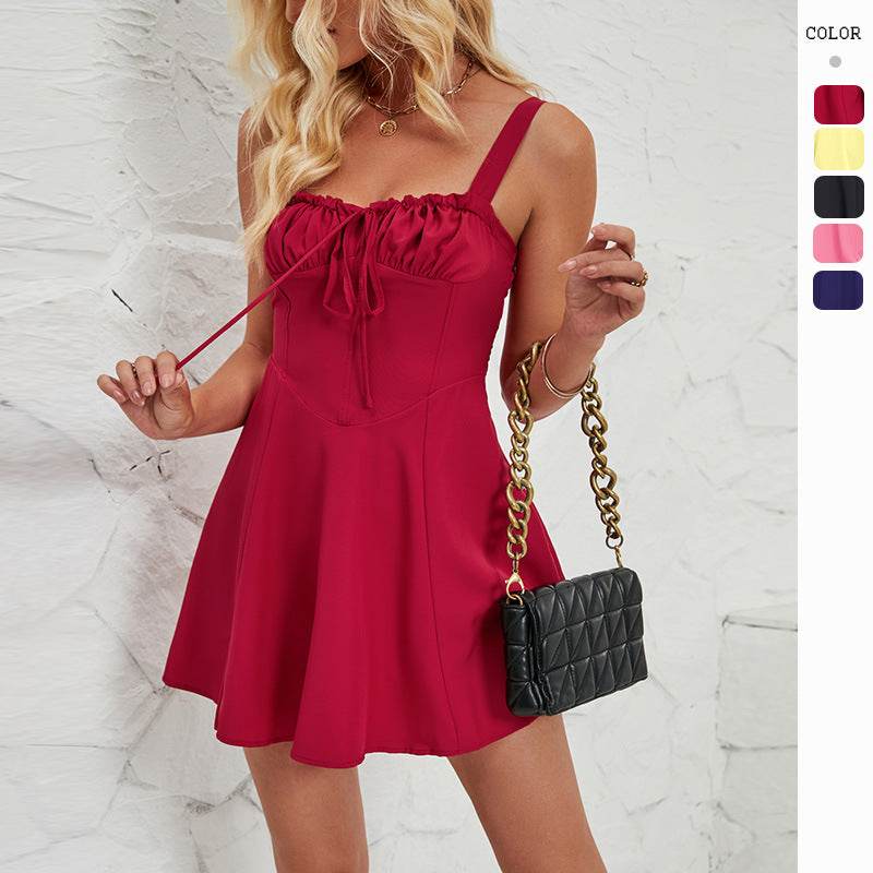 Woman wearing sleeveless lace-up A-line mini dress from Hot Topic Goods