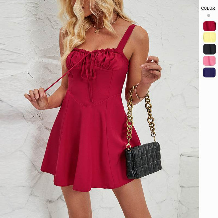 Woman wearing sleeveless lace-up A-line mini dress from Hot Topic Goods