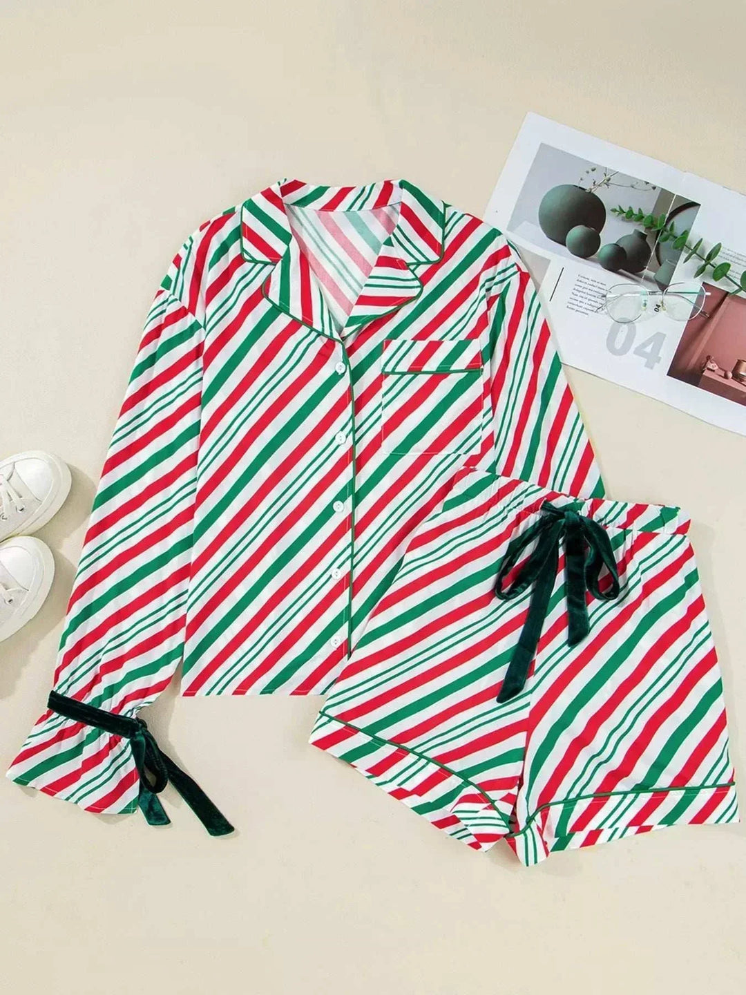 Women wearing striped contrast velvet bow pajama set from Hot Topic Goods