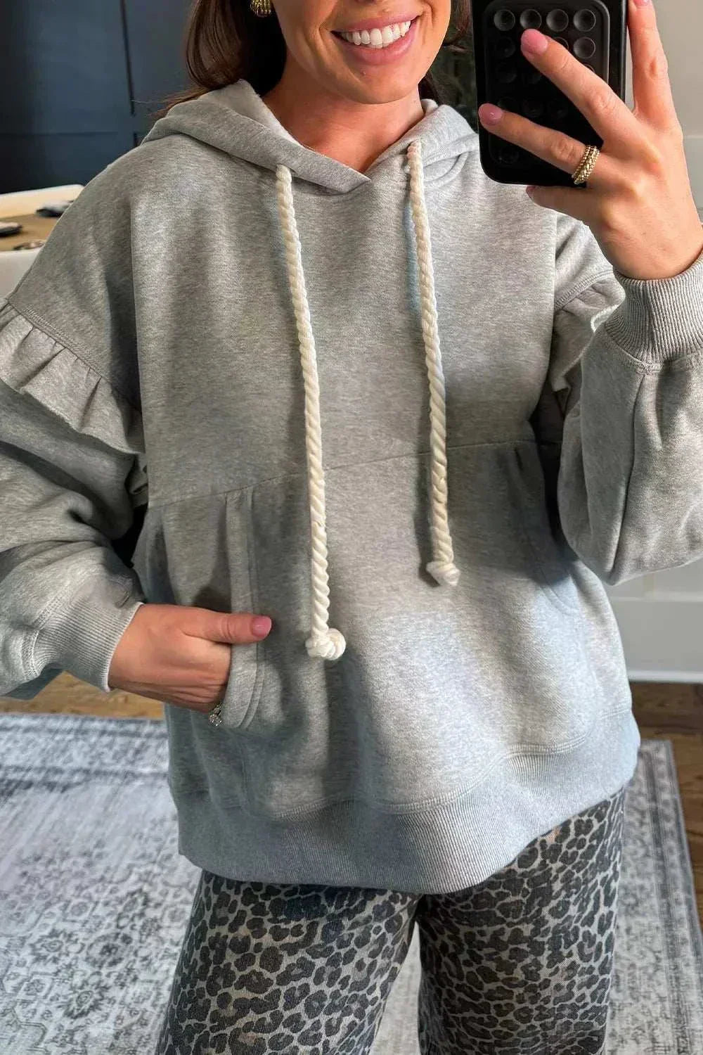 SYNZ Ruffled Hoodie with feminine ruffles and adjustable drawstring hood from Hot Topic Goods