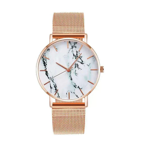 Rose gold mesh band watch with marble face and slim profile.