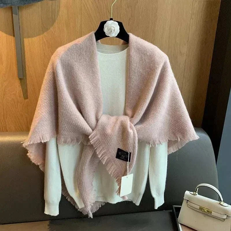 Women's thick tassel triangle shawl scarf draped over shoulders with textured fabric and decorative tassels
