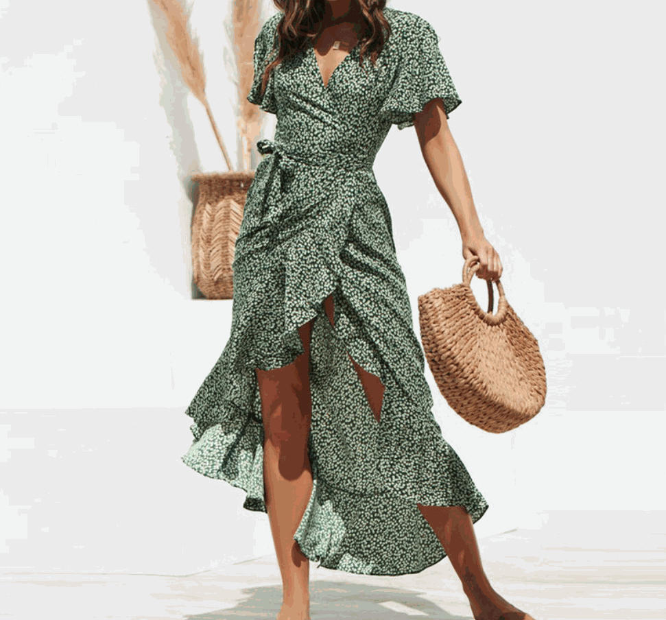 Woman wearing V-neck floral chiffon maxi dress with colorful flower print and flowing silhouette
