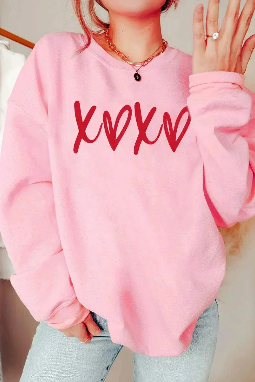 Valentine's Day Sweatshirt from Hot Topic Goods with heart graphic and cozy fabric