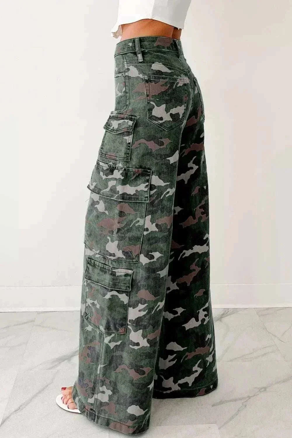 Women’s Camo Cargo Pants in green, gray, and black camouflage cotton-blend denim with a high waist and multiple flap pockets