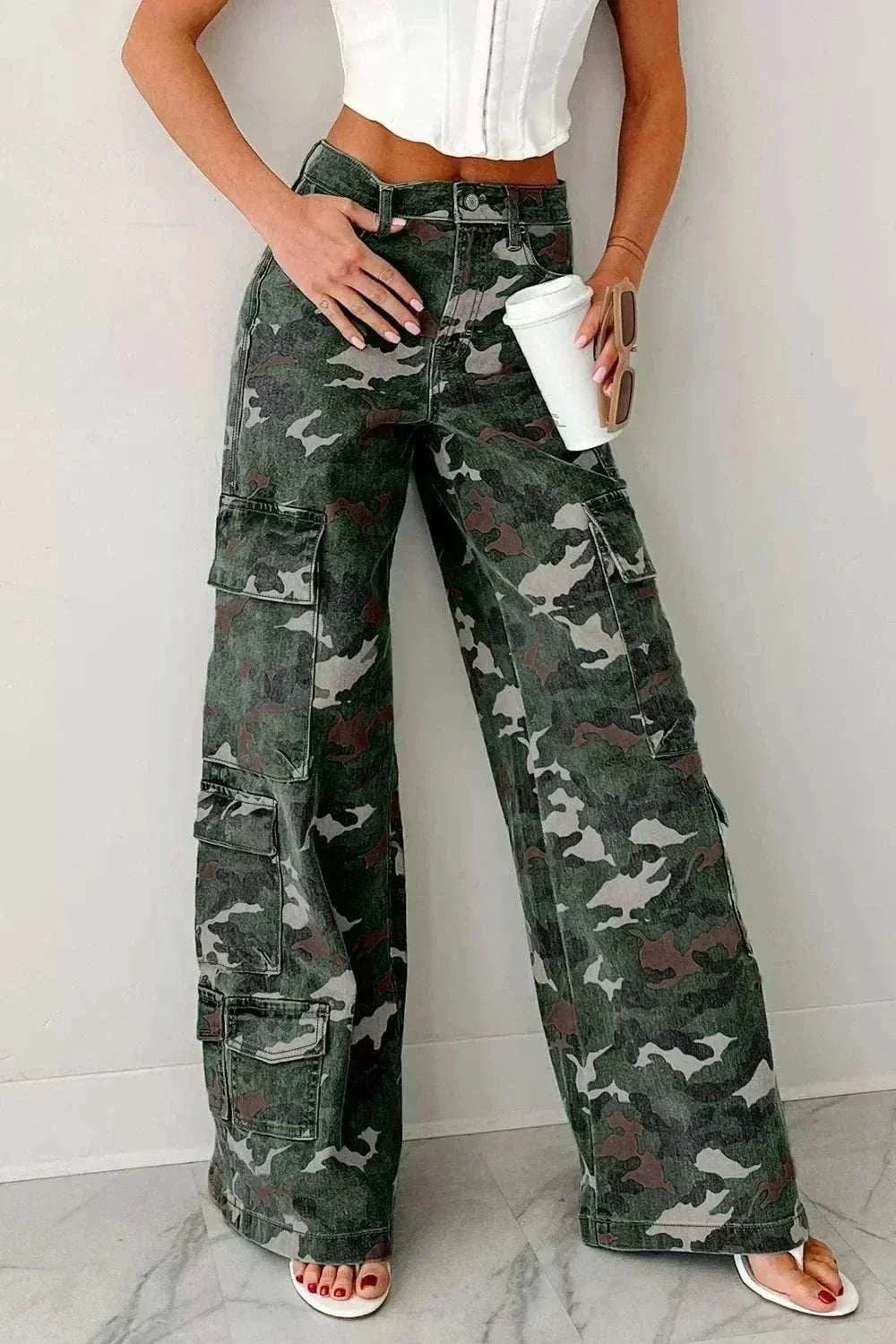 Women’s Camo Cargo Pants in green, gray, and black camouflage with a high waist, belt loops, and roomy cargo pockets