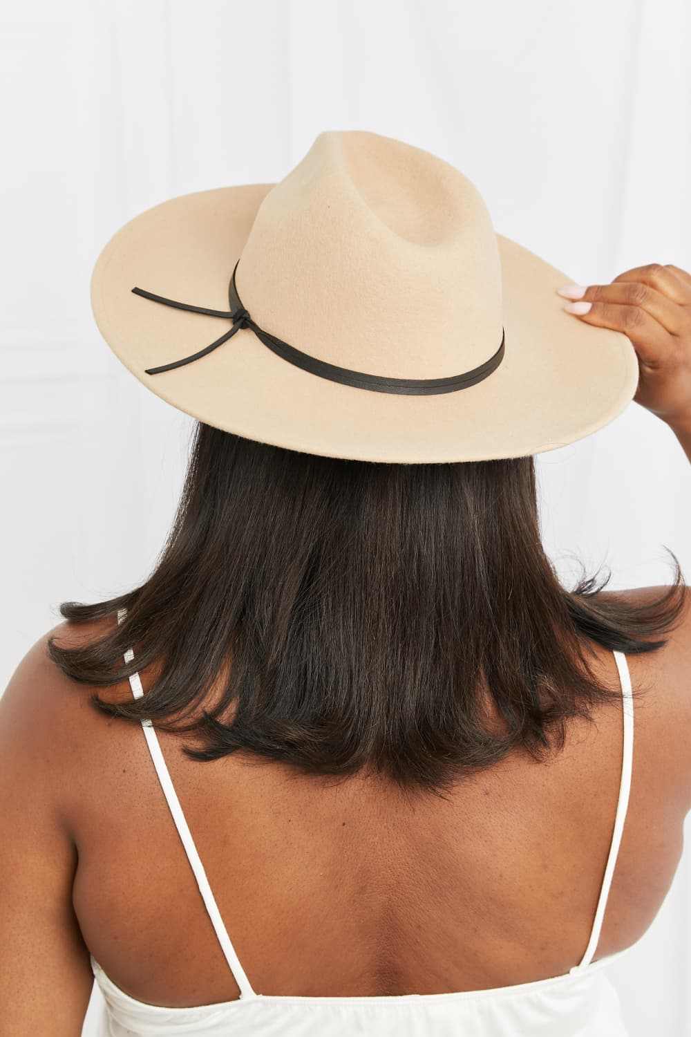 Women’s Classic Fedora Hat in light beige felt with a wide brim, pinched crown, and slim black band