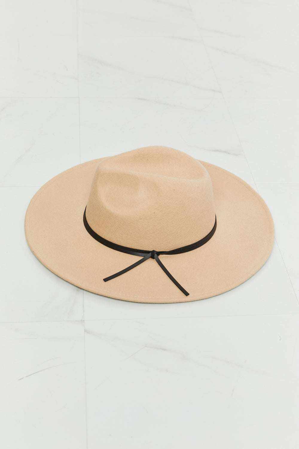 Women’s Classic Fedora Hat in beige felt with a wide brim, indented crown, and thin black band tied at the side