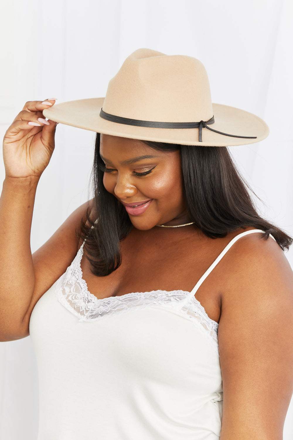 Women’s Classic Fedora Hat in light beige with a structured crown, wide brim, and slim black band