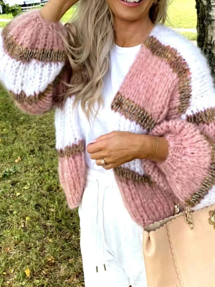 Women’s Color Block Cardigan in fluffy pink and white knit with brown trim, open front and oversized sleeves.