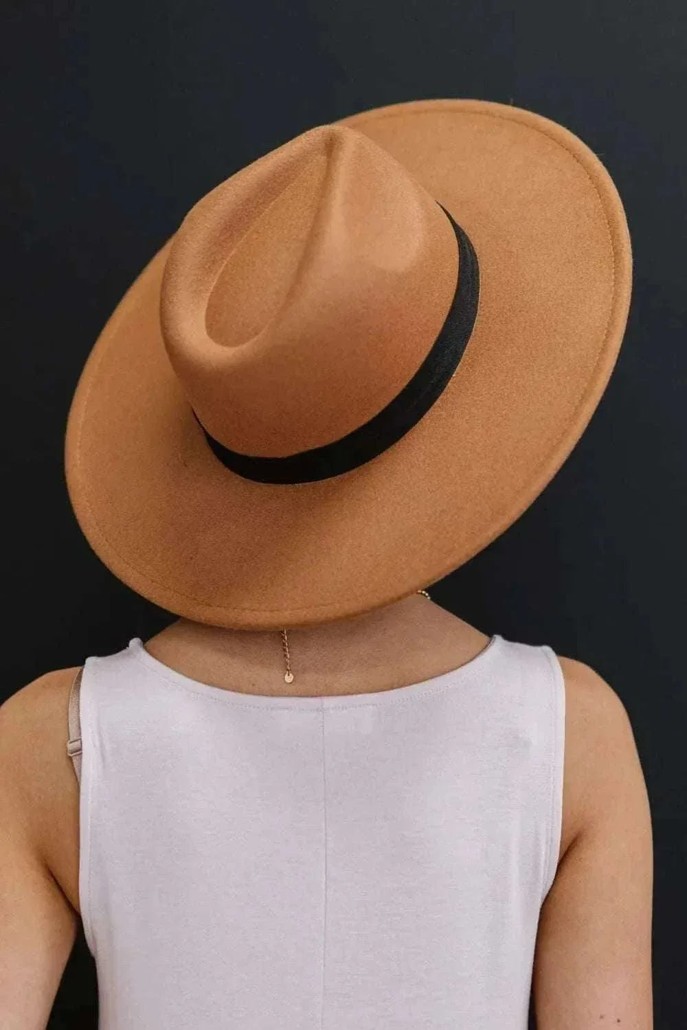 Women’s Fashion Fedora Hat in warm tan with a black band, wide brim and classic structured crown