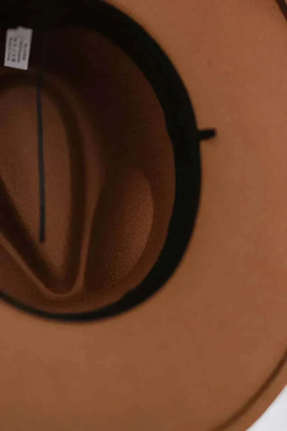 Women’s Fashion Fedora Hat in tan felt-like material with a wide brim, black band and matching dark inner trim
