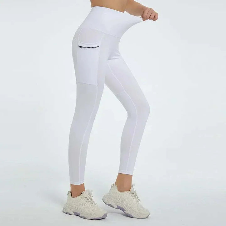 Women’s High-Waisted Leggings in white stretch fabric, with a wide waistband and a small zippered side pocket.