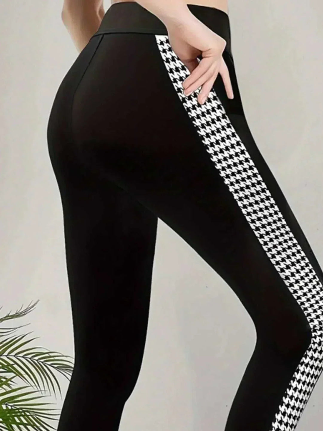 Women’s Houndstooth Leggings in black stretch fabric with a high waistband and bold black-and-white side panels