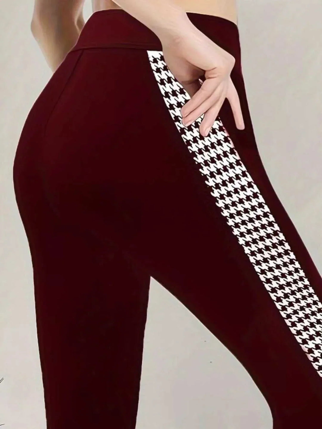 Women’s Houndstooth Leggings in red stretch fabric with a high waist and bold black-and-white houndstooth side stripe
